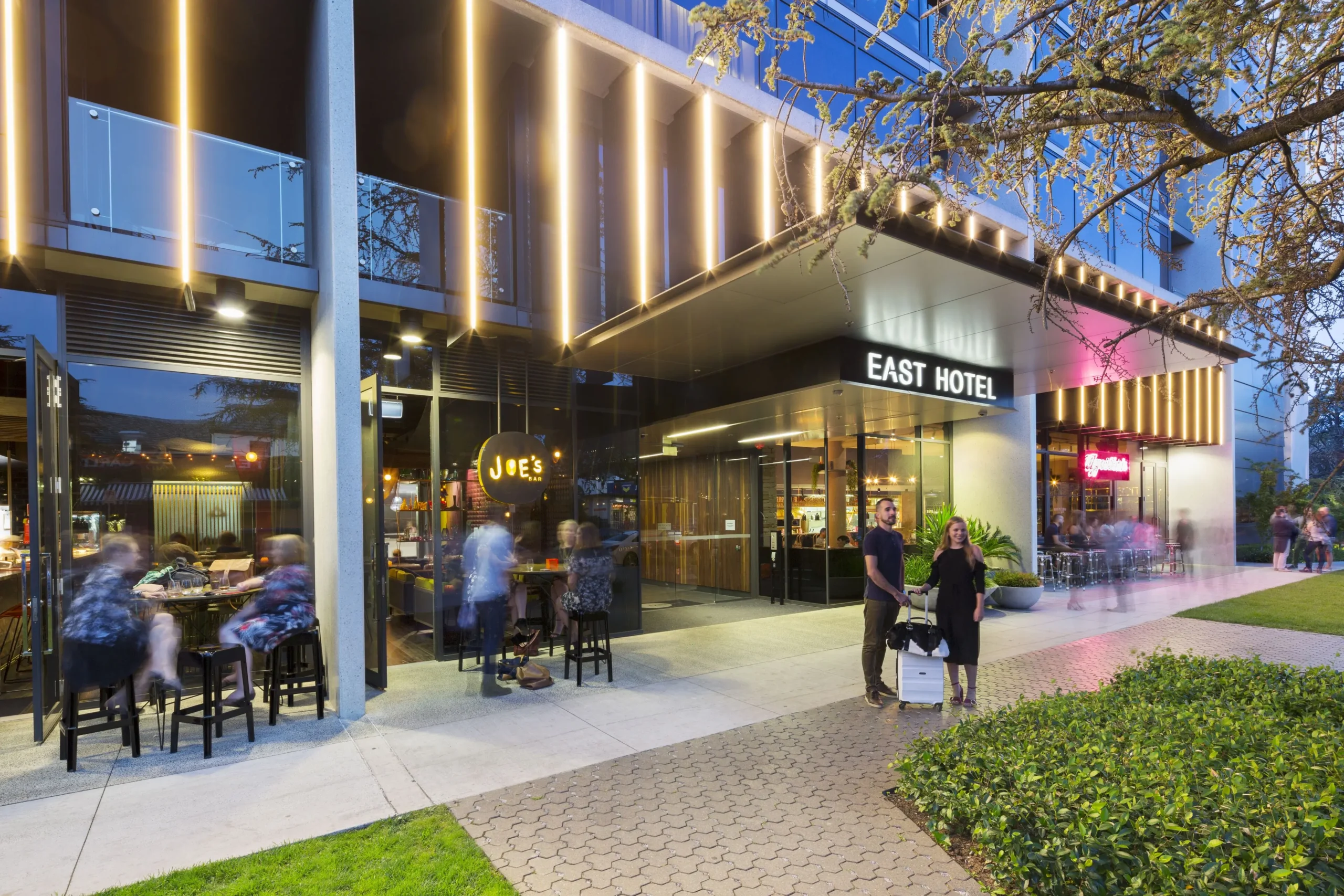 People standing outside of East Hotel Canberral