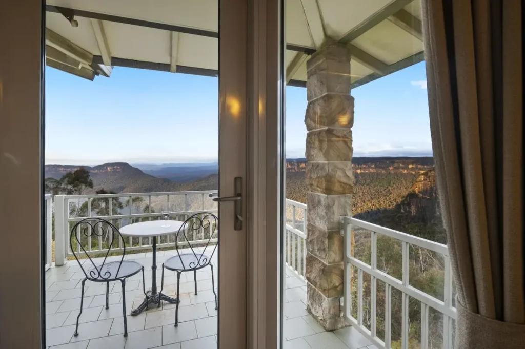 Balcony view from Echoes Boutique Hotel & Restaurant overlooking the Jamison Valley in Katoomba, offering boutique luxury accommodation during a Blue Mountains family holiday.