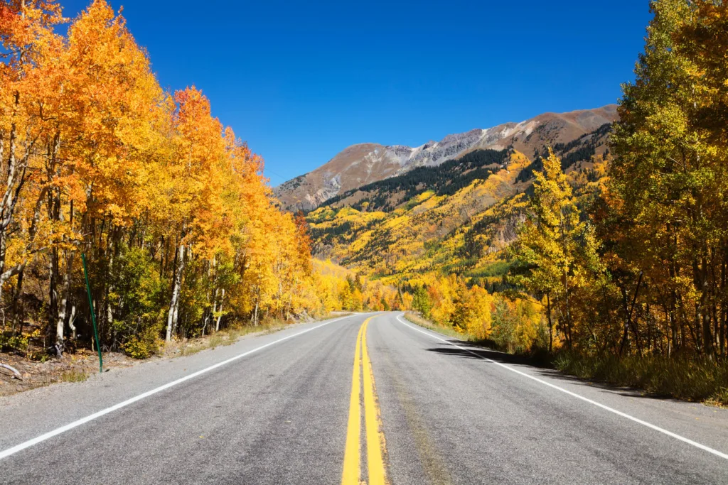 The Million Dollar Highway winding through the snowy peaks of the San Juan Mountains in Colorado.