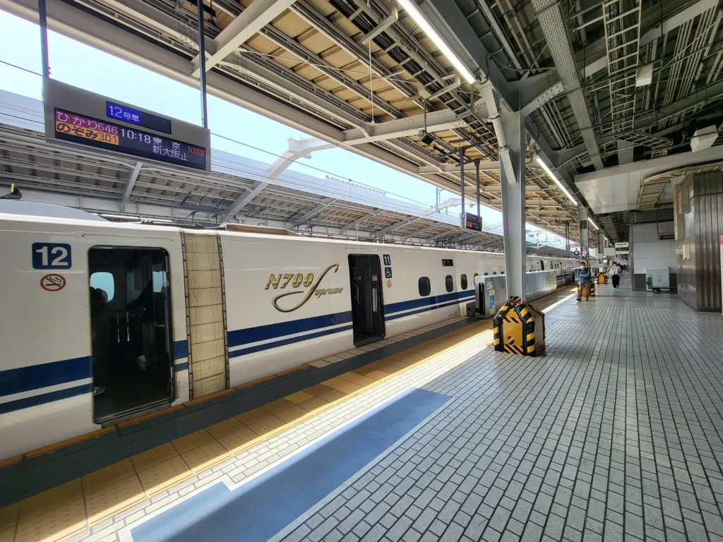 Shinkansen train at platform with doors open