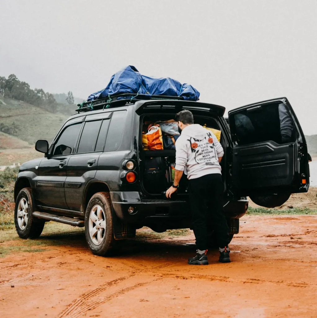 man packing car