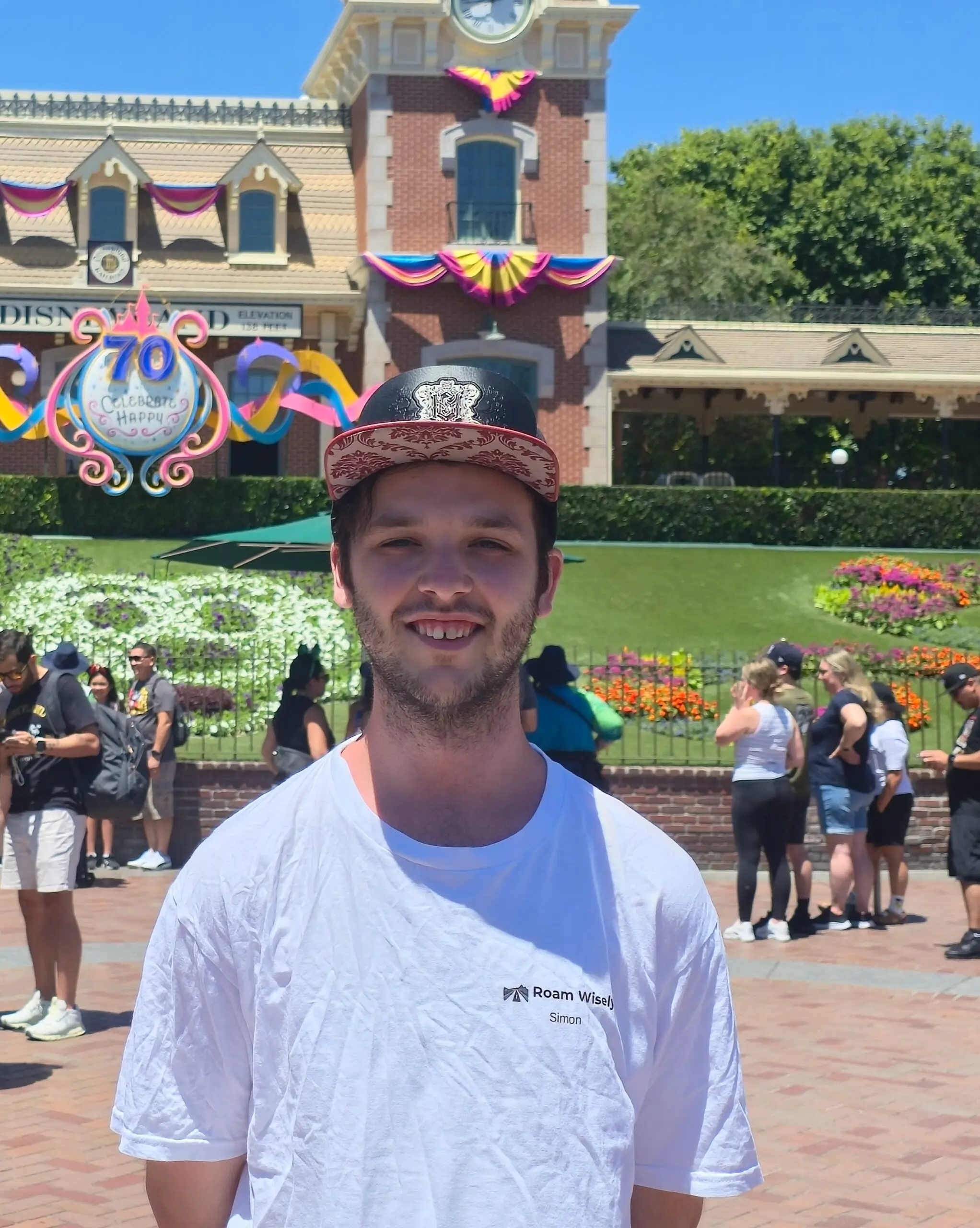 Simon from Roam Wisely on the ground at Disneyland