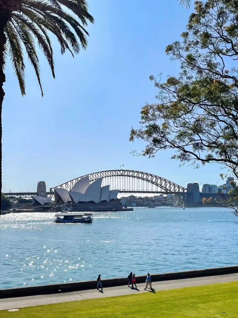 Sydney Harbour shines under clear skies with the Opera House and Harbour Bridge in view, a classic starting point for anyone wondering how to see more of NSW