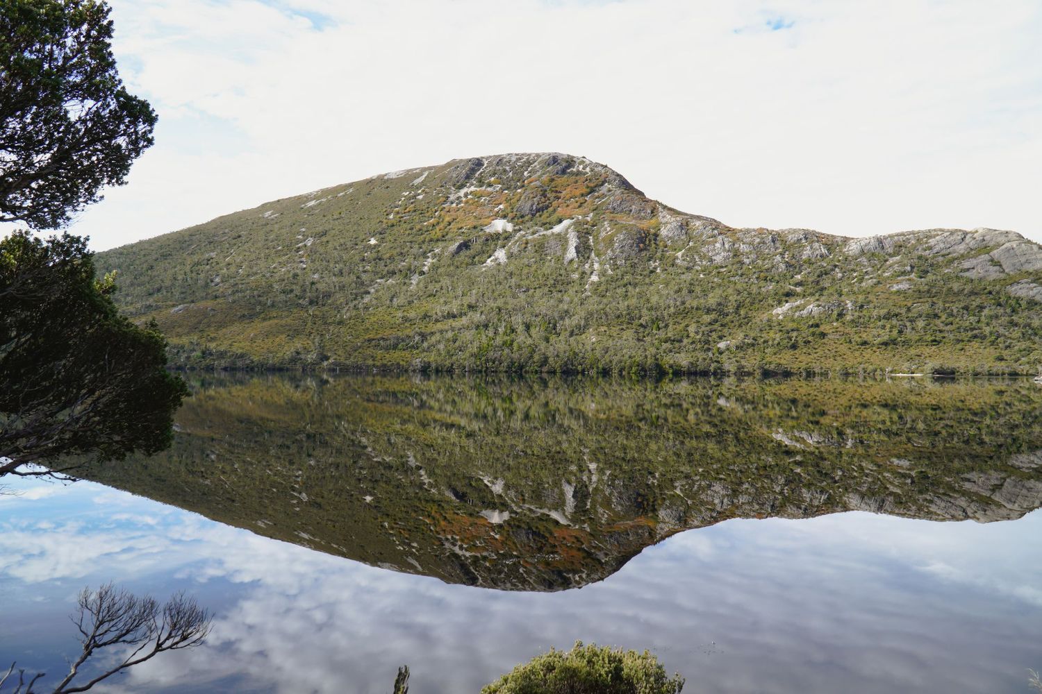 A mountain peak reflected in the still water of Dove Lake, Cradle Mountain-Lake St Clair National Park, Tasmania