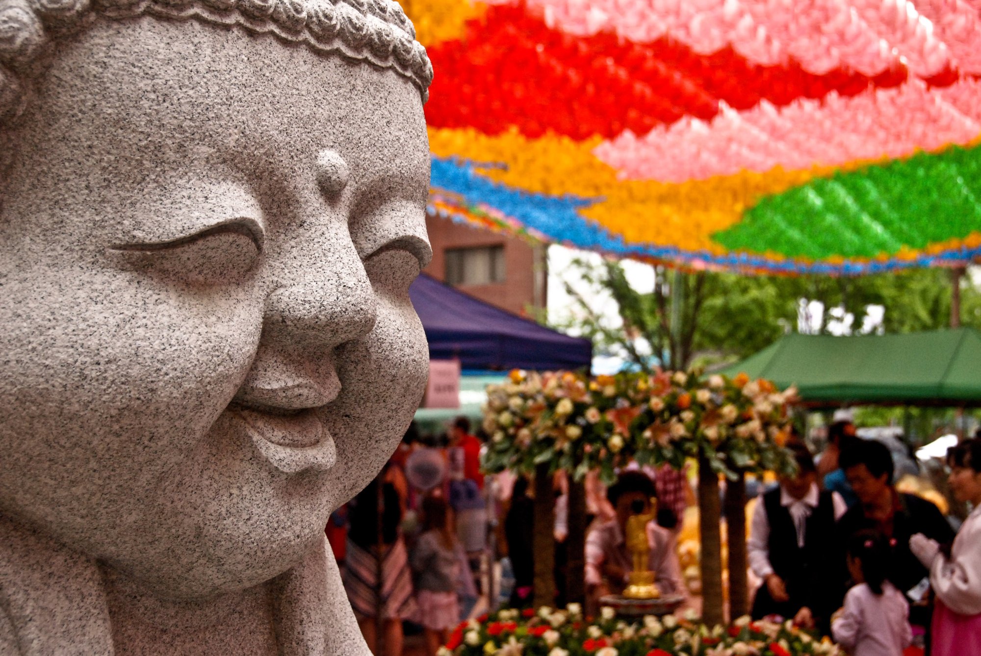 Colourful lotus lanterns strung above a Buddhist temple courtyard in Seoul