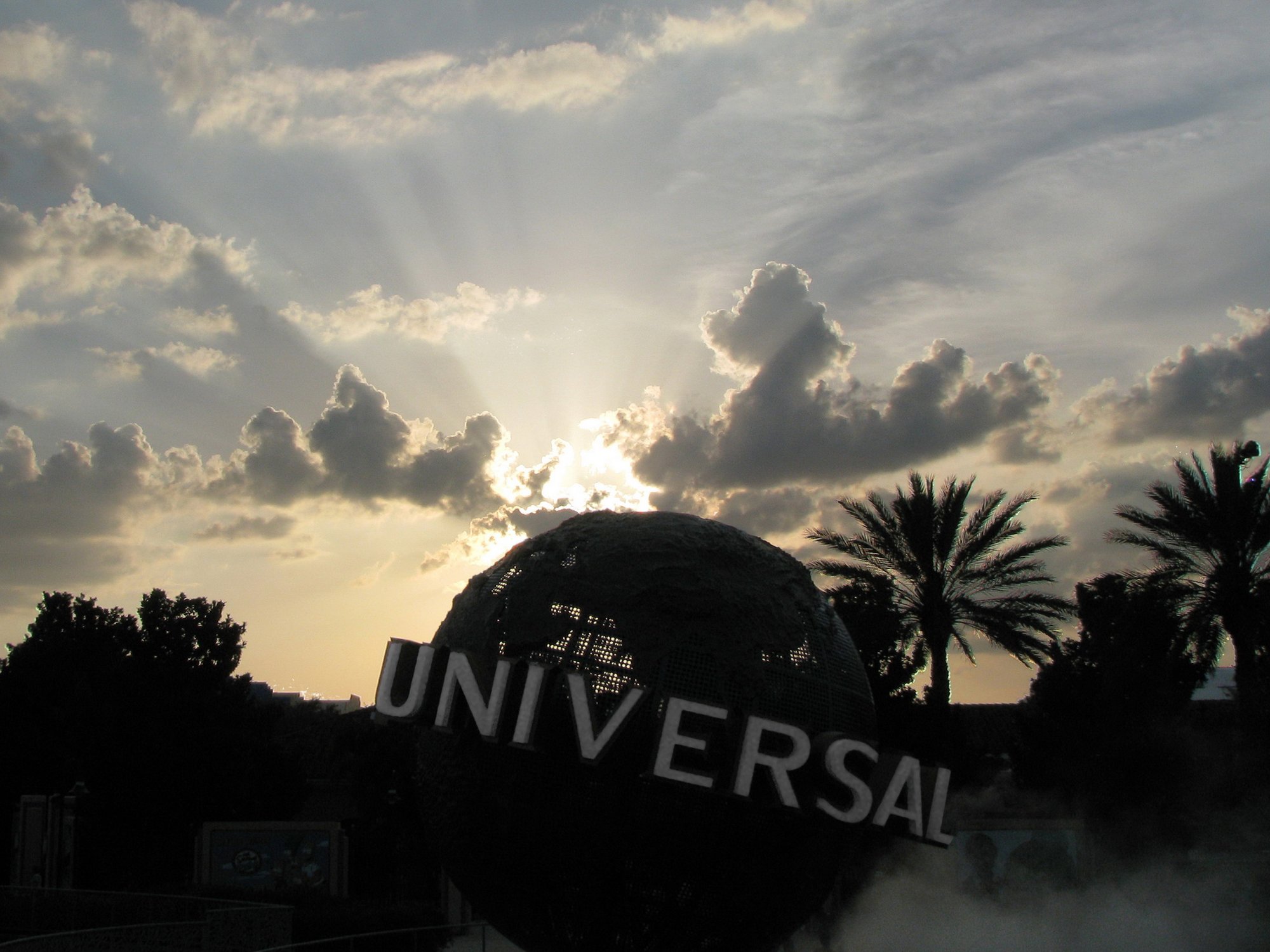 The Universal Orlando globe under a blue Florida sky